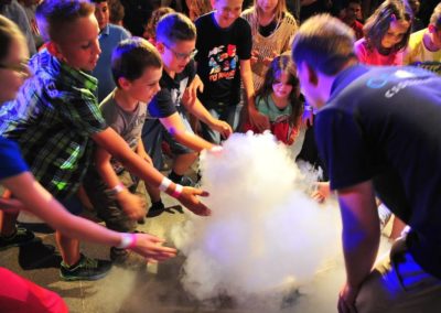 Kids looking at a scientific experiment
