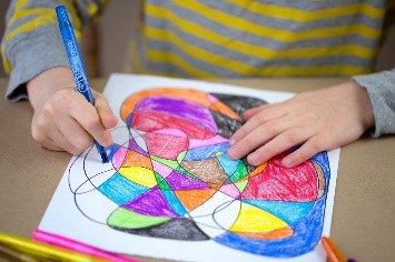 Child is drawing in the nursery