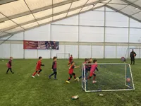 Preschool children play soccer at the International Happy Kids Nursery and Kindergarten in Budapest