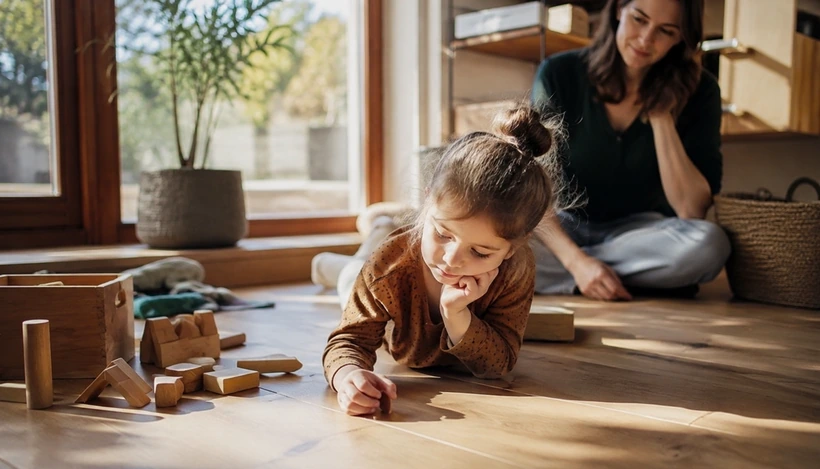 Young child enjoying quiet unstructured play at home without screens